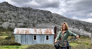 Sally Stanton mountain biking in the Snowy Mountains.