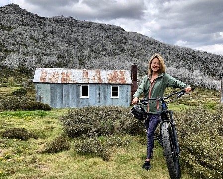 Sally Stanton mountain biking in the Snowy Mountains.